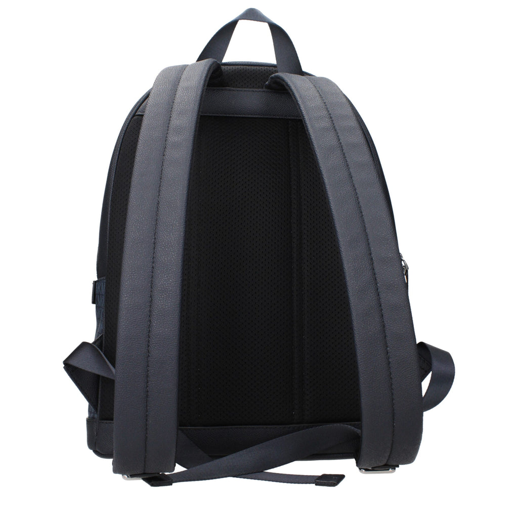 Michael Kors blue fabric backpack with adjustable straps and front zip pocket, stylish and functional for everyday use.
