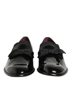 Black leather slip-on men's loafers by Dolce & Gabbana, showcasing sleek design and polished finish.