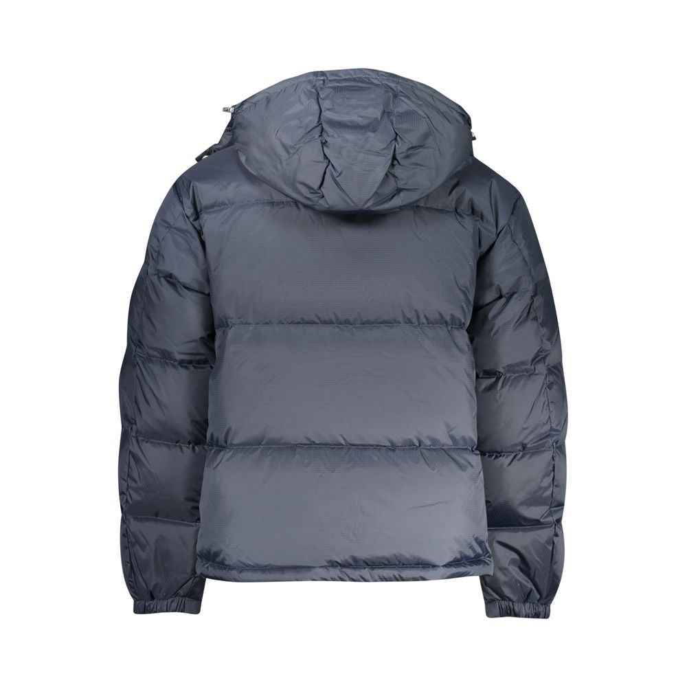 Tommy Hilfiger men's blue polyester jacket with a zip front and logo detail, suitable for casual wear.
