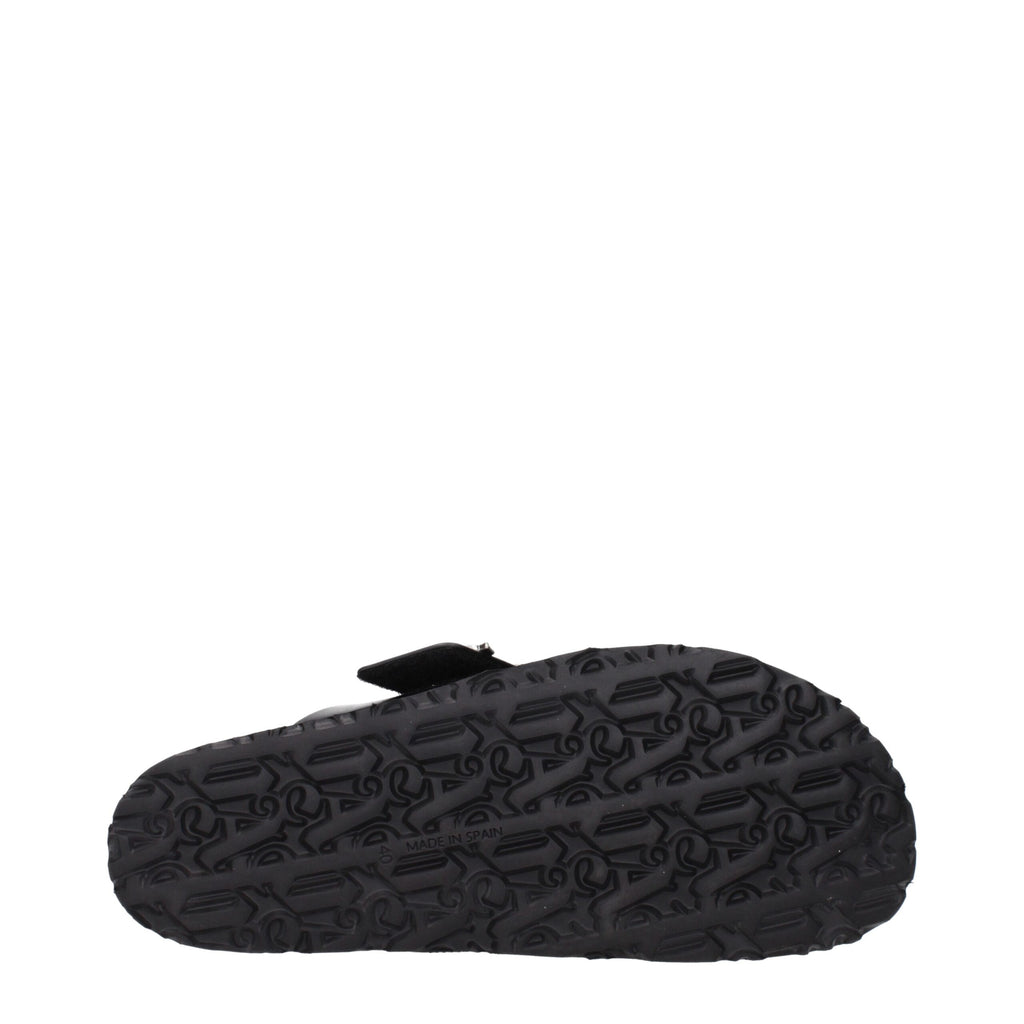 Palm Angels black leather slippers with sleek design and plush interior, perfect for casual and luxury comfort.