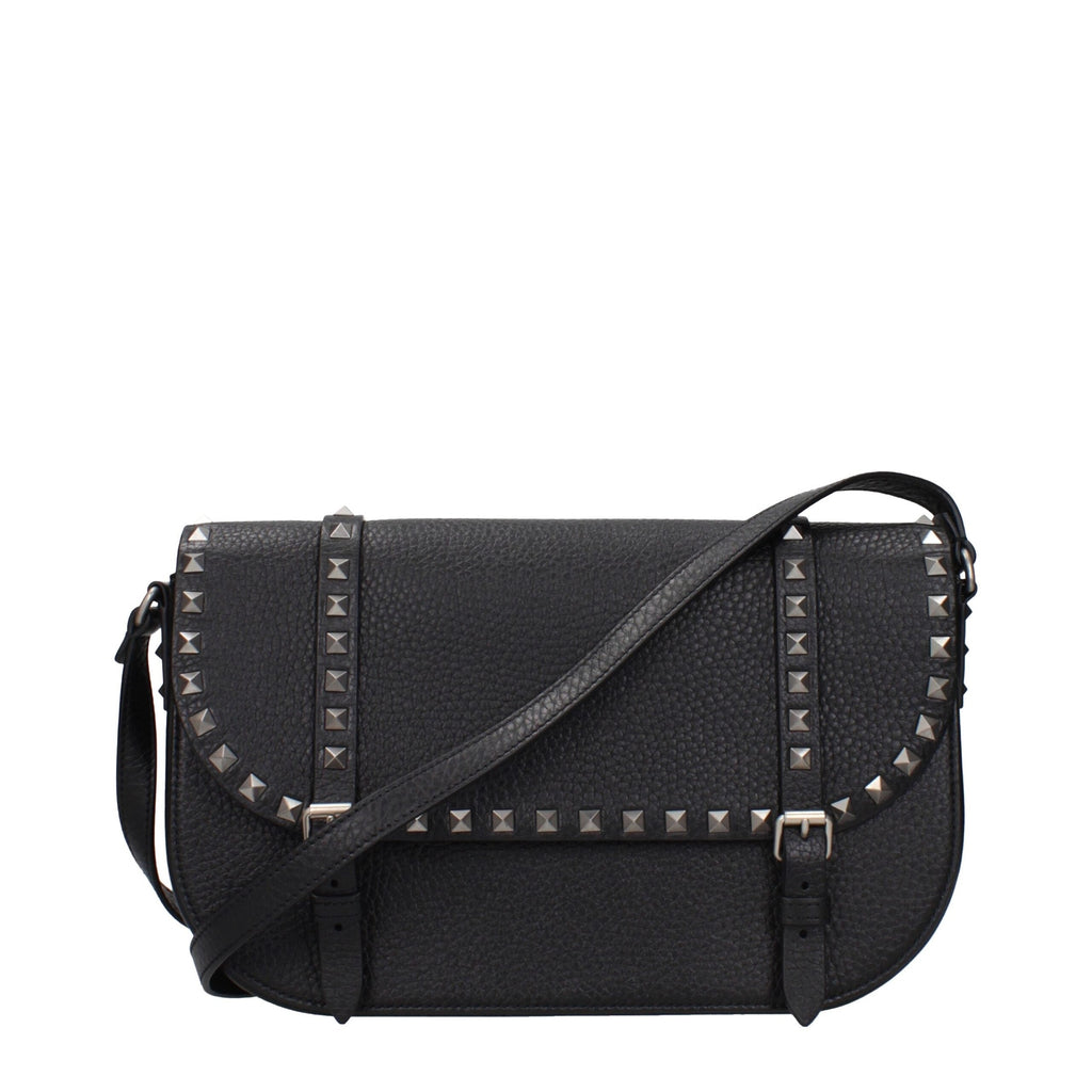 Black leather Valentino Garavani crossbody bag with sleek design and adjustable strap, showcasing luxury Italian craftsmanship.