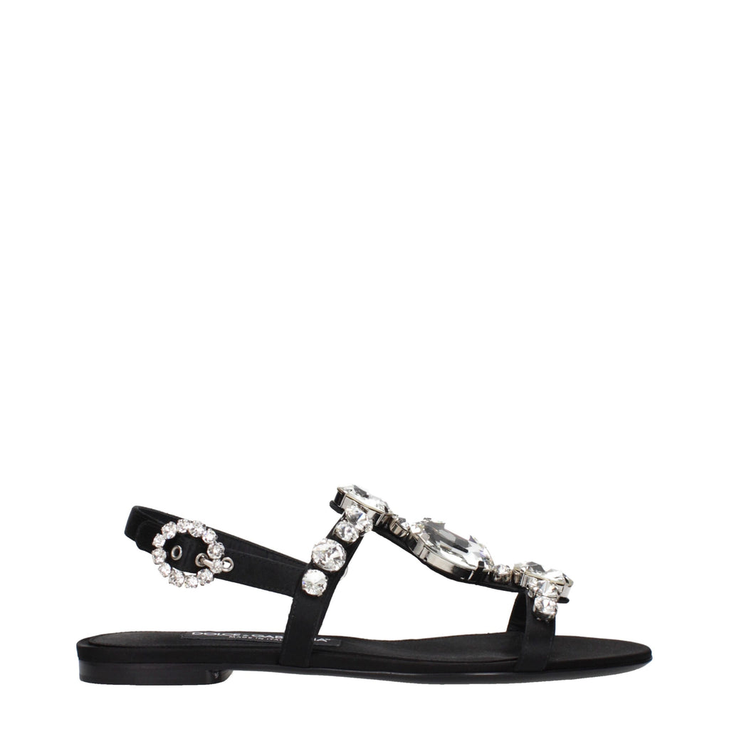 Black satin flat sandals by Dolce & Gabbana with sleek design and minimal detailing, perfect for elegant casual wear.