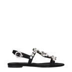 Black satin flat sandals by Dolce & Gabbana with sleek design and minimal detailing, perfect for elegant casual wear.