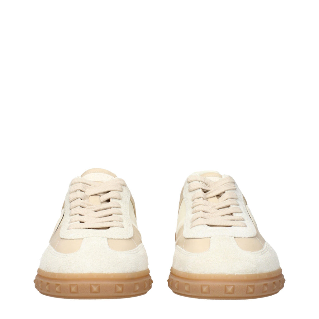Valentino Garavani beige fabric low top sneakers with white soles and subtle branding detail.