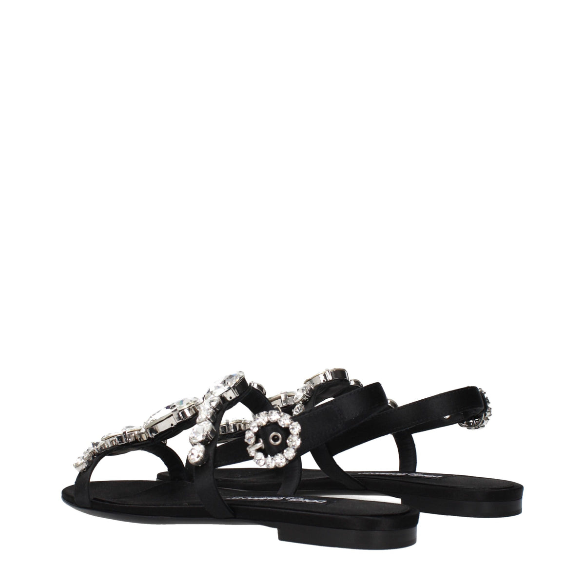 Black satin flat sandals by Dolce & Gabbana featuring sleek straps and elegant design, perfect for stylish summer footwear.