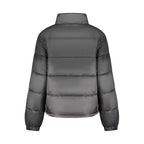 Black Tommy Hilfiger women's polyester jacket with a sleek design and front zipper, casual outerwear for everyday wear.