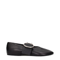 Black leather ballet flats by Jil Sander featuring sleek, minimalist design and comfortable slip-on style.