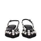 Black leather stiletto heel sandals by The Attico with sleek straps and high heel, perfect for stylish evening wear.