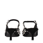 Black leather stiletto heel sandals by The Attico, featuring sleek straps and high heel design.
