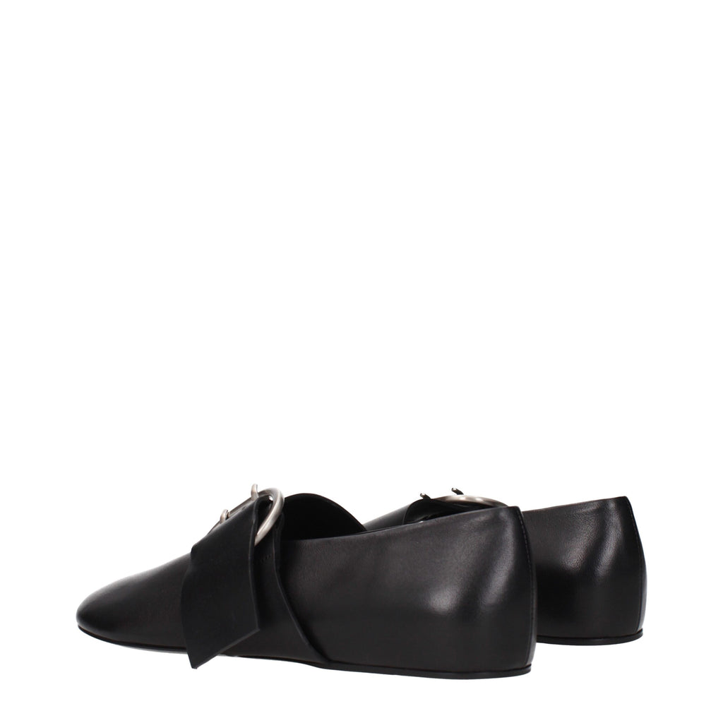 Black leather ballet flats by Jil Sander featuring a sleek, minimal design and rounded toe, perfect for casual or elegant wear.