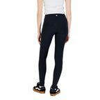 Converse black cotton leggings displayed on a model, showing the fitted, comfortable design and classic style.