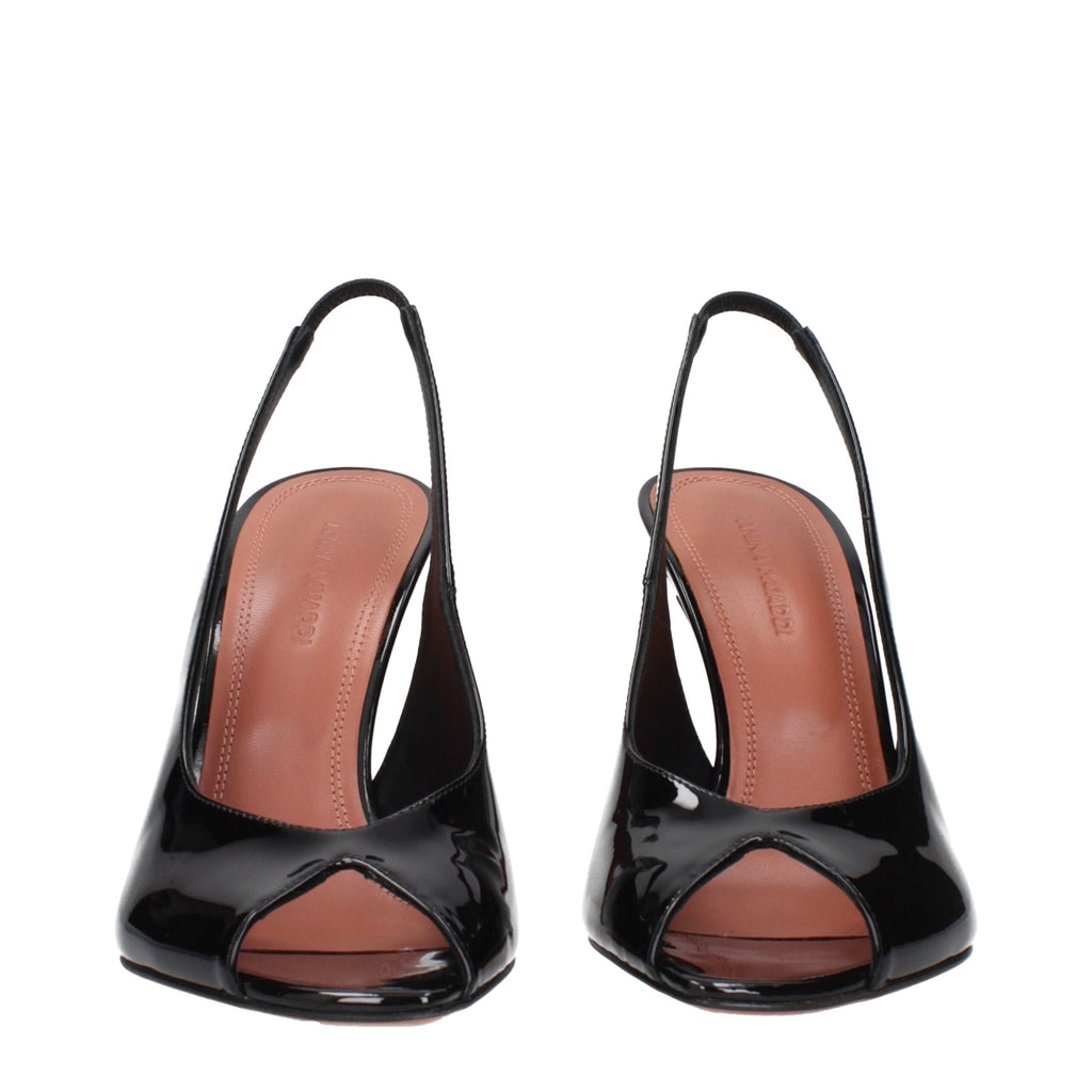Black leather stiletto heel sandals by Amina Muaddi with sleek straps and elegant design, perfect for stylish occasions.