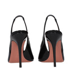Black leather stiletto heel sandals by Amina Muaddi with sleek straps and elegant design, perfect for formal or stylish occasions.