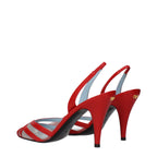 Red leather stiletto heel sandals by Valentino Garavani with sleek straps and elegant design.