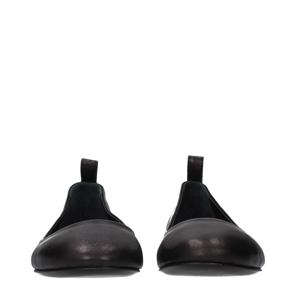 Black leather ballet flats by The Attico, featuring a sleek, classic design with a rounded toe and smooth finish.