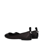 Black leather ballet flats by The Attico with a sleek, rounded toe and minimalist design on a plain background.