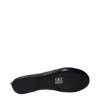 Black leather ballet flats by The Attico with pointed toes and a sleek, minimalist design.