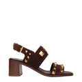 Brown leather strap-on sandals from Valentino Garavani with open toe design and ankle strap for a stylish summer look.