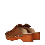 Valentino Garavani brown leather slippers with slip-on design and sleek finish, perfect for casual or stylish wear.