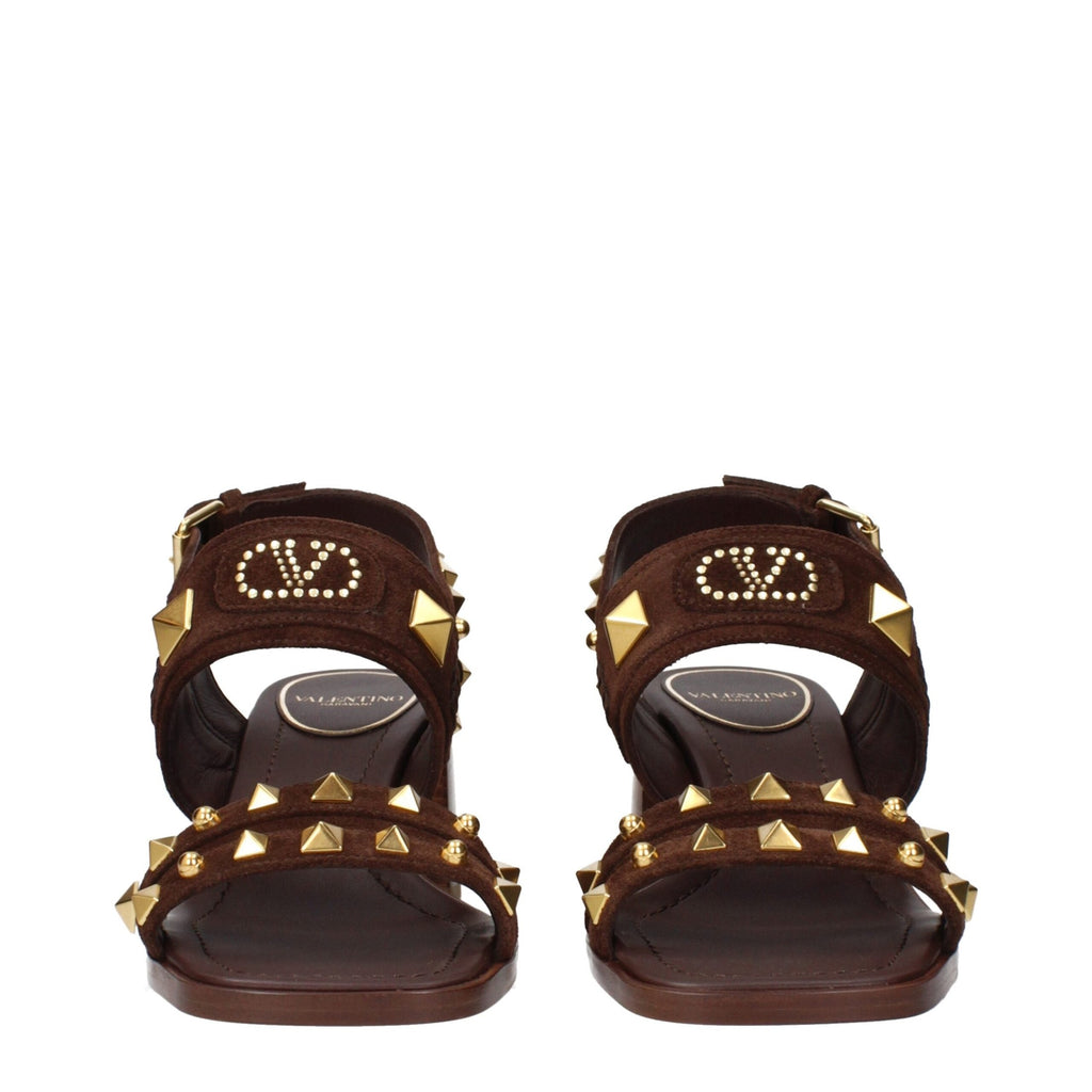 Brown leather strap-on sandals by Valentino Garavani with open toe design and ankle strap for a stylish, sophisticated look.