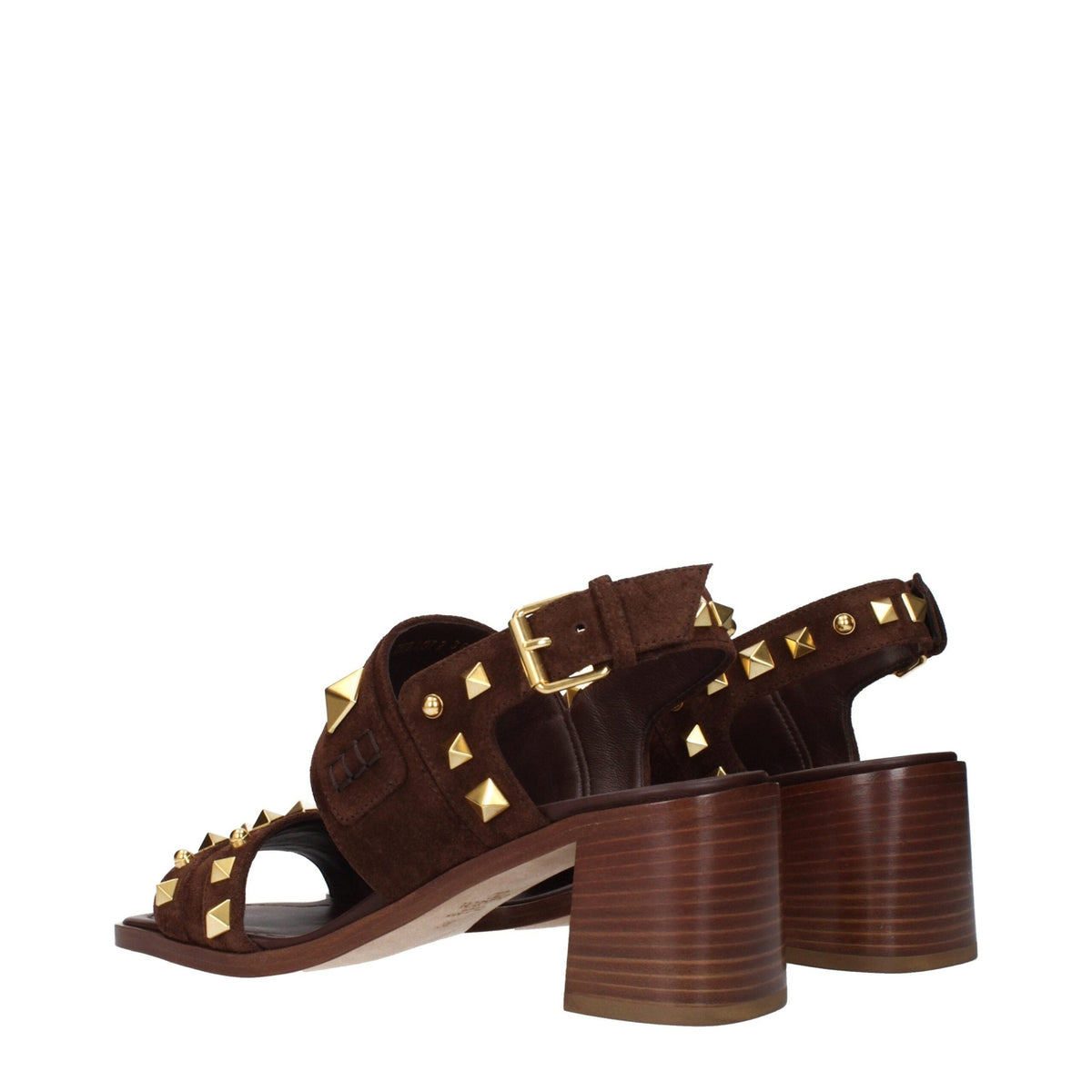 Brown leather strap-on sandals by Valentino Garavani featuring open toes and ankle straps on a neutral background.