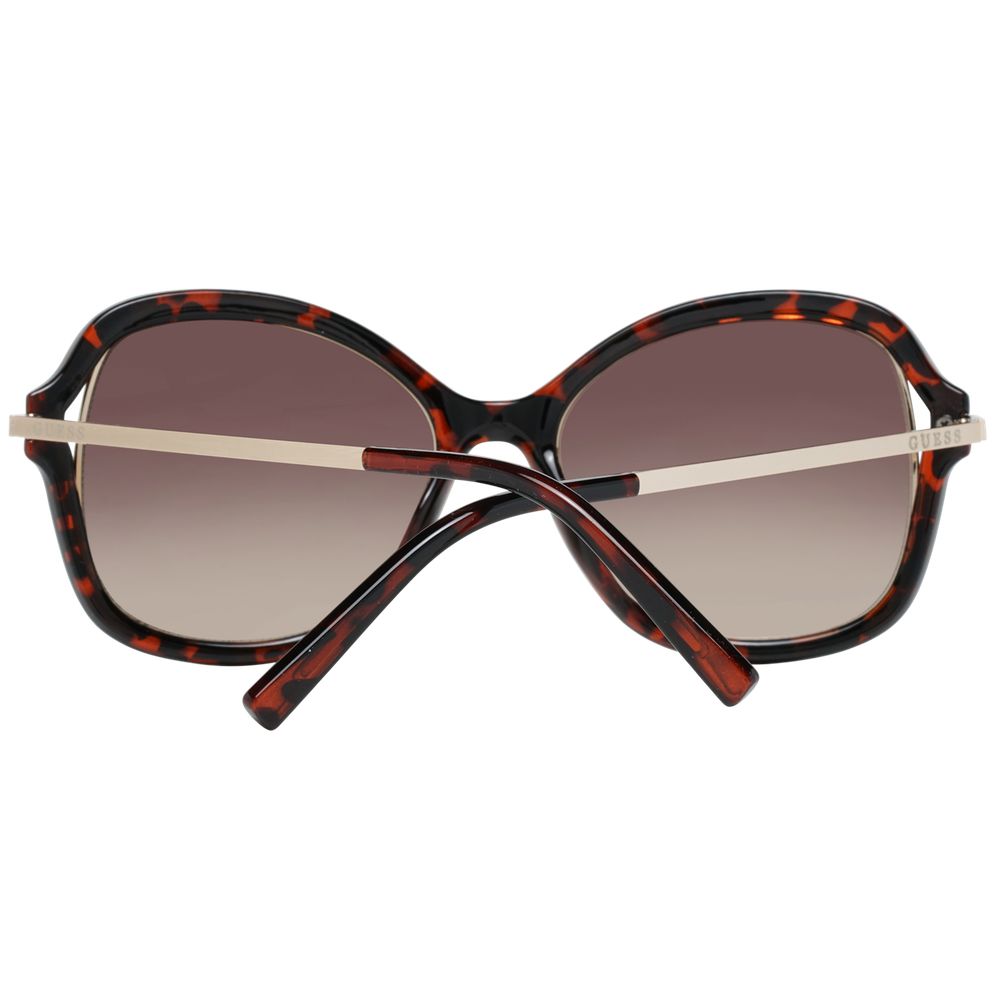 Guess brown metal and plastic sunglasses with rounded frames and tinted lenses, stylish and lightweight for sun protection.