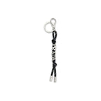 Prada black recycled polyamide keychain with silver-tone hardware and Prada logo detail, hanging from a set of keys.