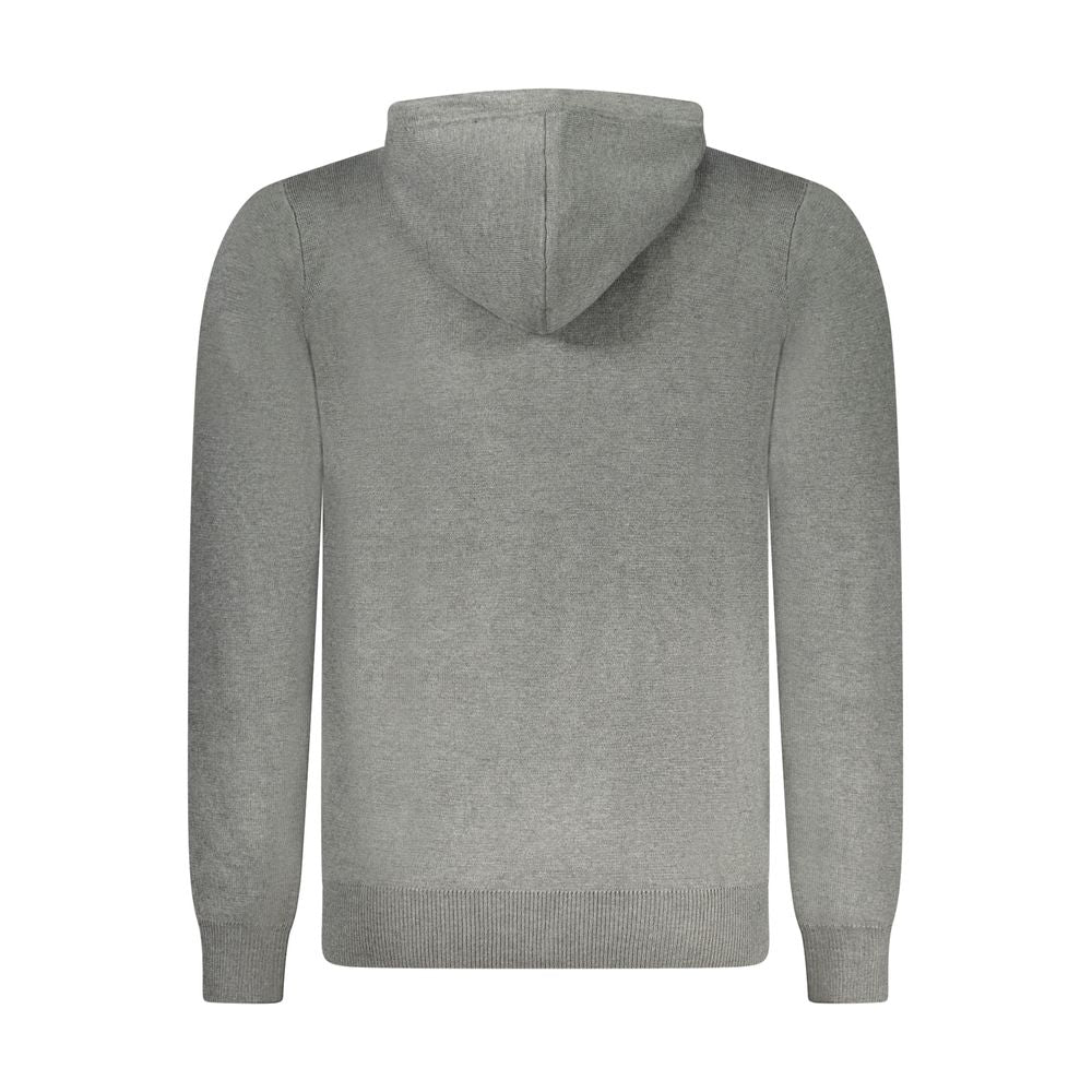 Norway 1963 Grigio Poliammide men's cardigan hanging on a wooden rack, featuring a button-up front and ribbed cuffs.