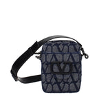 Valentino Garavani blue fabric crossbody bag with adjustable strap and silver hardware, stylish accessory for everyday wear.