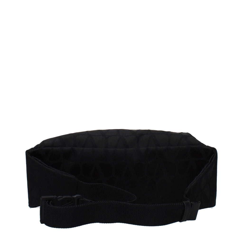Valentino Garavani black fabric backpack with sleek design and adjustable straps, perfect for stylish everyday use.