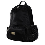 Dolce & Gabbana black nylon backpack with adjustable straps and logo details, designed for stylish everyday use.