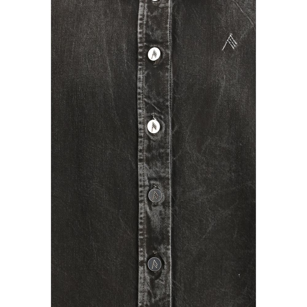 Black denim shirt from The Attico featuring a classic collar, button closure, and relaxed fit, shown on a mannequin.