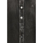 Black denim shirt from The Attico featuring a classic collar, button closure, and relaxed fit, shown on a mannequin.