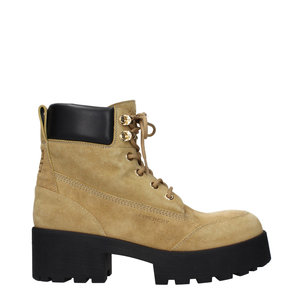 Givenchy brown leather ankle boots with sleek design and pointed toes, showcasing high-quality craftsmanship and stylish footwear.