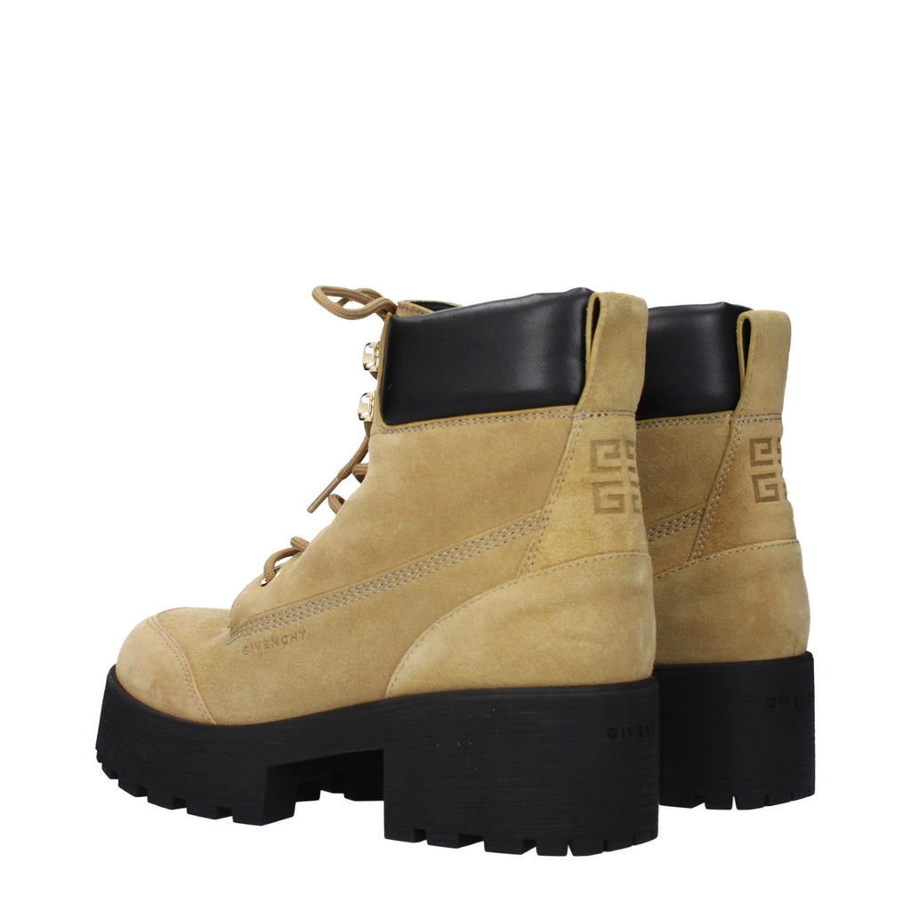 Givenchy brown leather ankle boots with sleek design and pointed toes, showcasing stylish footwear for women.