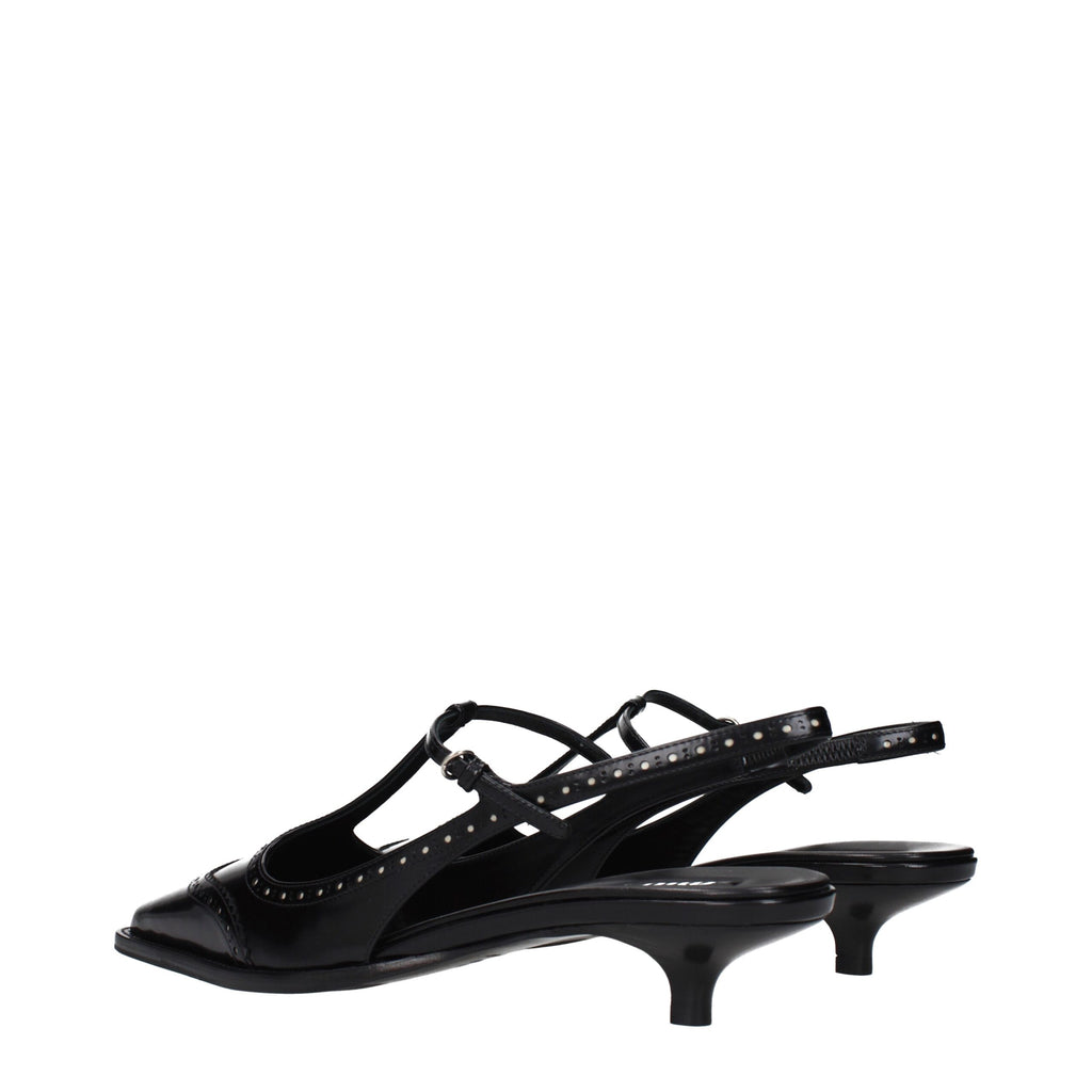 Black leather Miu Miu mid heel pumps with pointed toes and elegant design, perfect for stylish occasions.