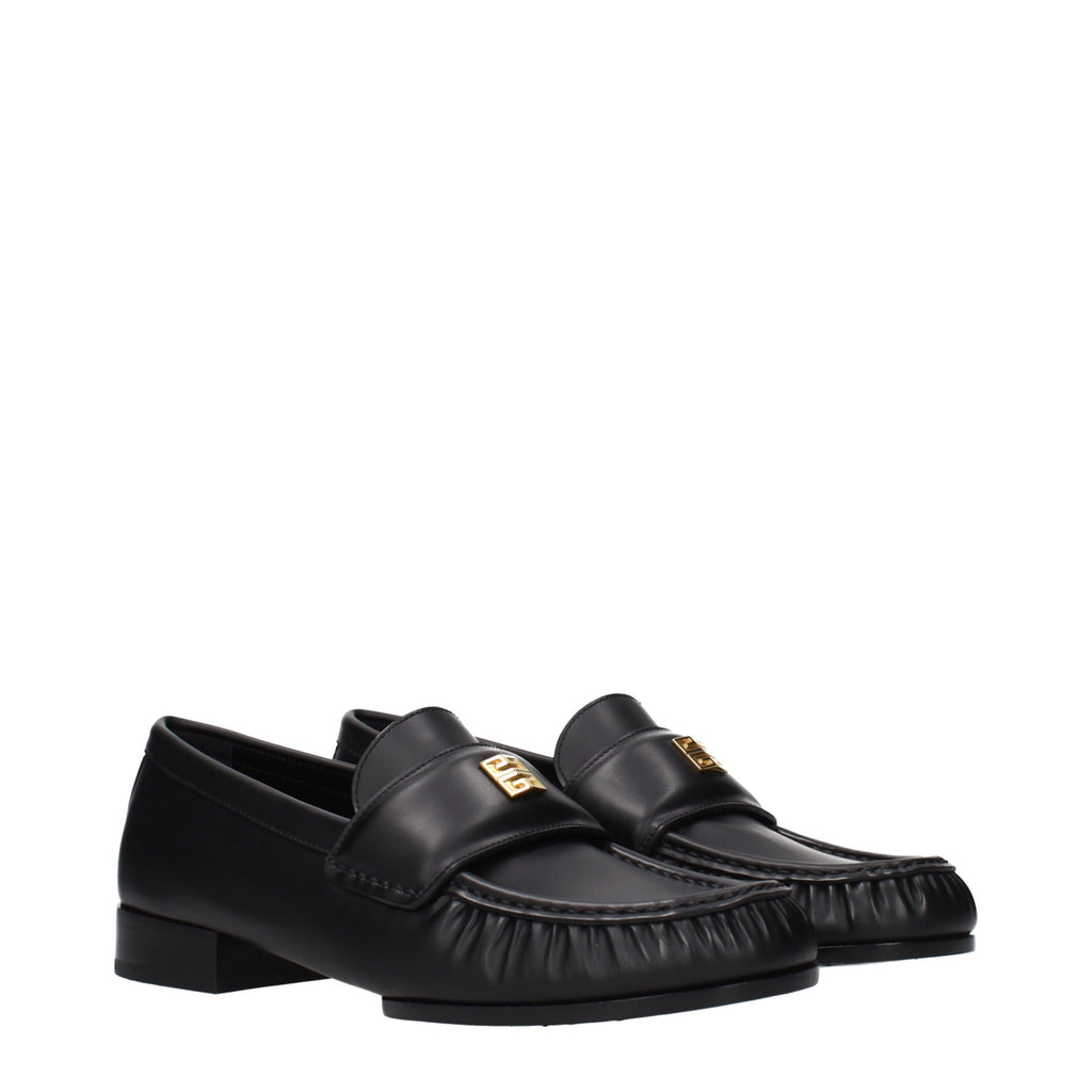 Givenchy black leather slip-on loafers with sleek design and polished finish, featuring classic silhouette and subtle detailing.