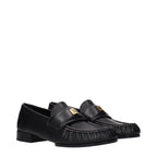 Givenchy black leather slip-on loafers with sleek design and polished finish, featuring classic silhouette and subtle detailing.