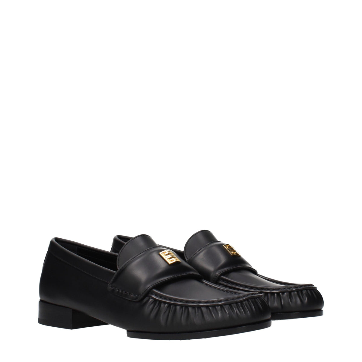 Givenchy black leather slip-on loafers with sleek design and polished finish, featuring classic silhouette and subtle detailing.