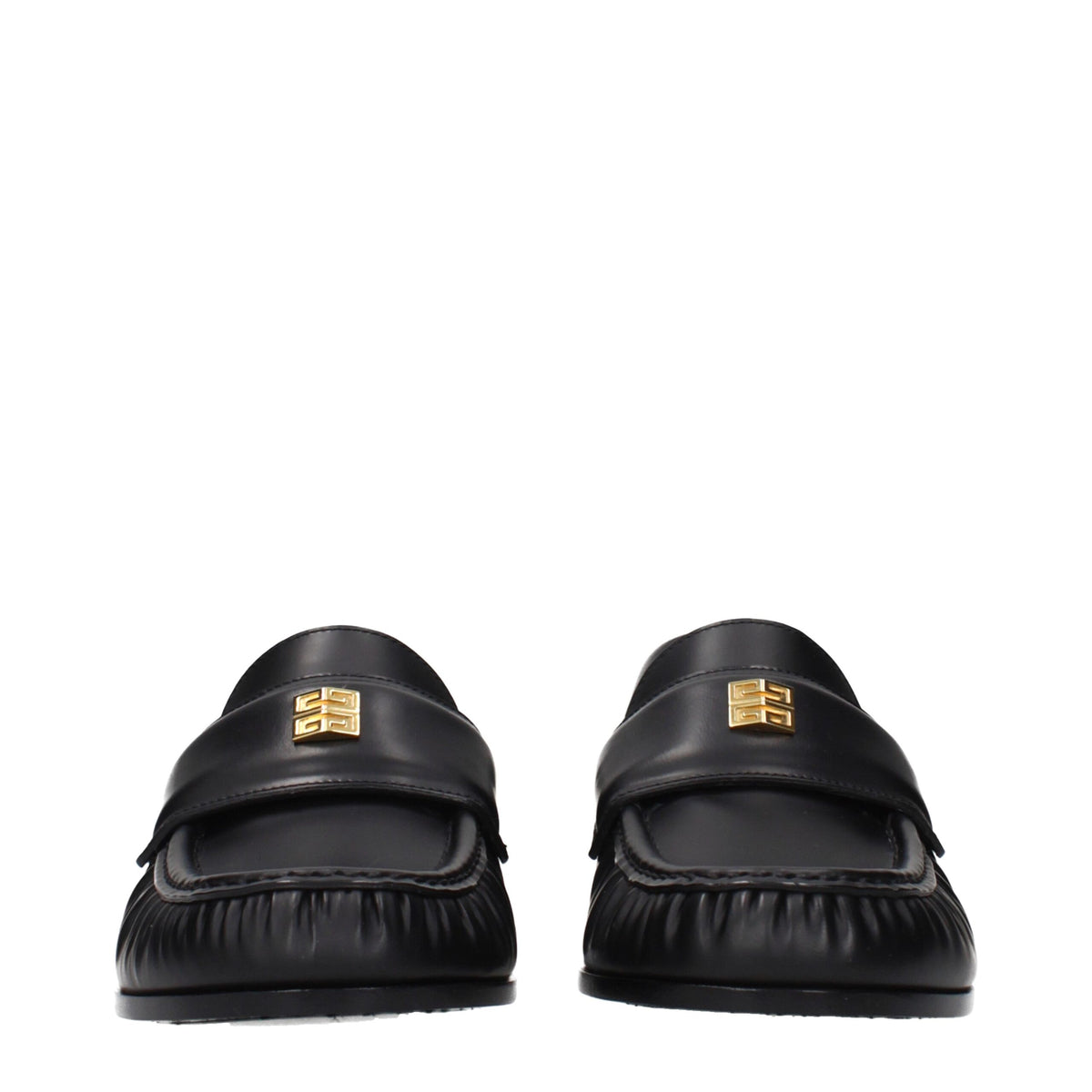 Givenchy black leather slip-on loafers featuring sleek design and classic style, perfect for elegant casual wear.