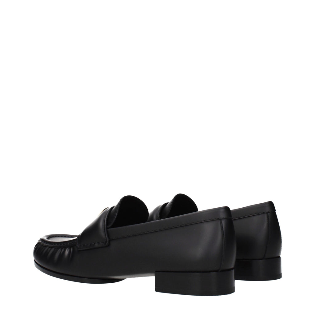 Givenchy black leather slip-on loafers with sleek design and polished finish, showcasing the stylish men's footwear.