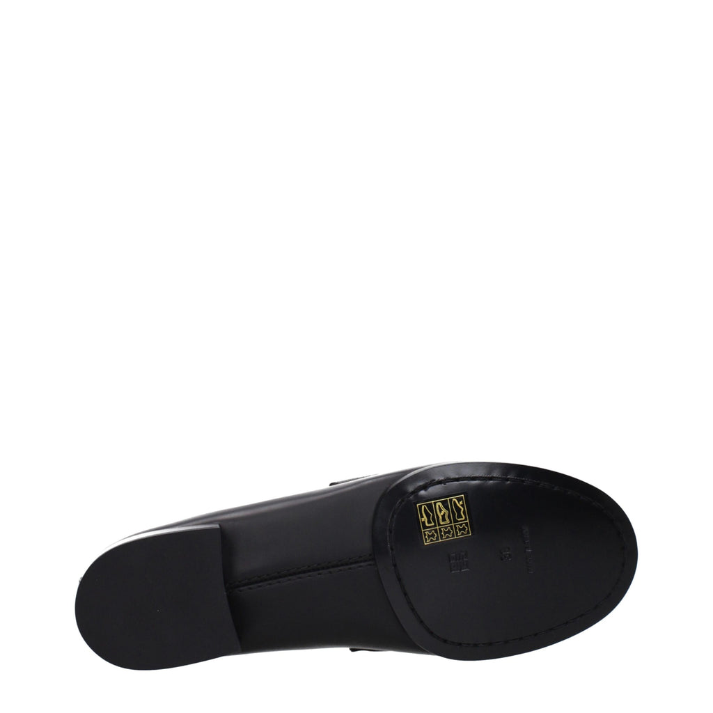 Givenchy black leather slip-on loafers with sleek design and polished finish, perfect for stylish formal or casual wear.