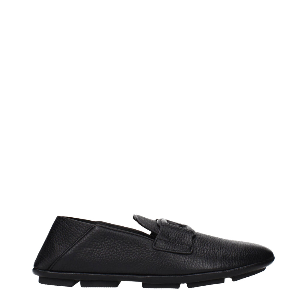 Black leather slip-on loafers by Dolce & Gabbana featuring sleek design and polished finish.