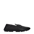 Black leather slip-on loafers by Dolce & Gabbana featuring sleek design and polished finish.