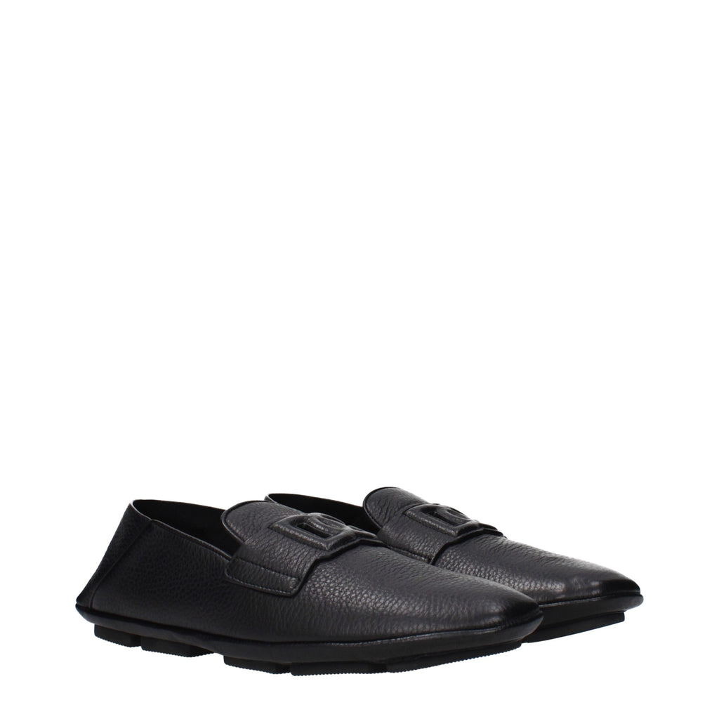 Black leather slip-on loafers by Dolce & Gabbana with sleek design and subtle branding, perfect for stylish casual or formal wear.