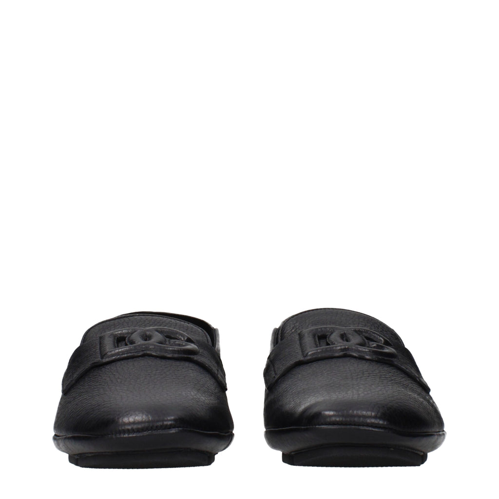 Black leather slip-on loafers by Dolce & Gabbana featuring a sleek design and classic silhouette.