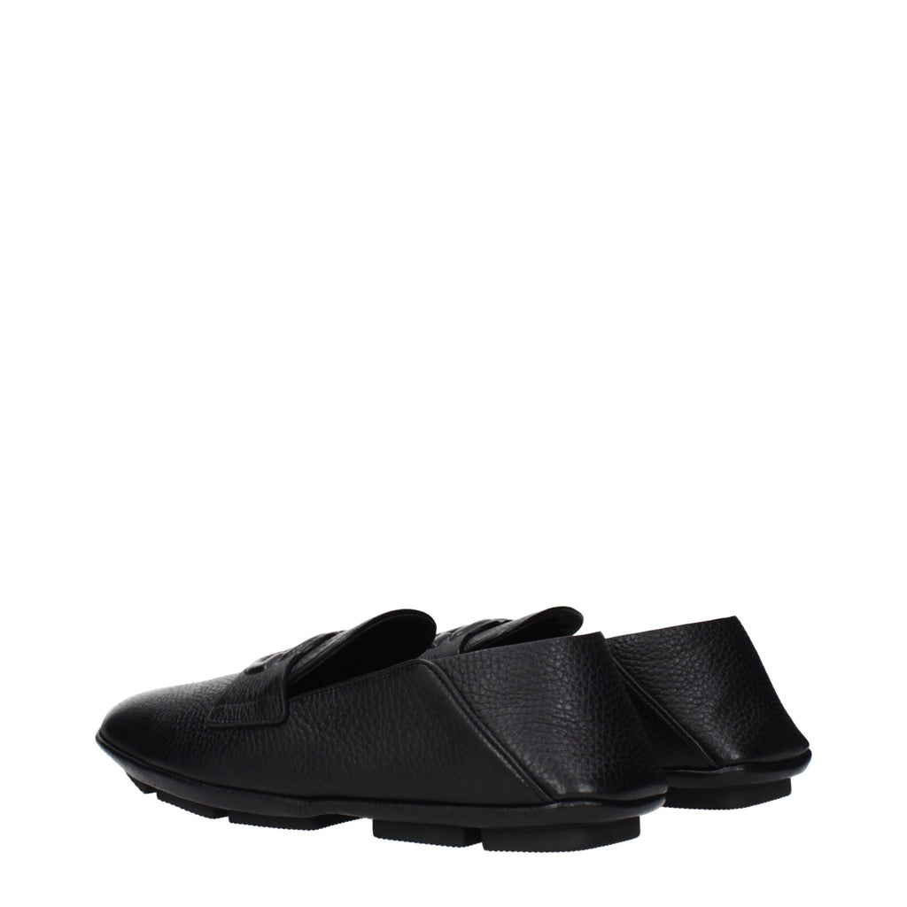 Black leather slip-on loafers by Dolce & Gabbana featuring sleek design and polished finish.