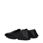 Black leather slip-on loafers by Dolce & Gabbana featuring sleek design and polished finish.