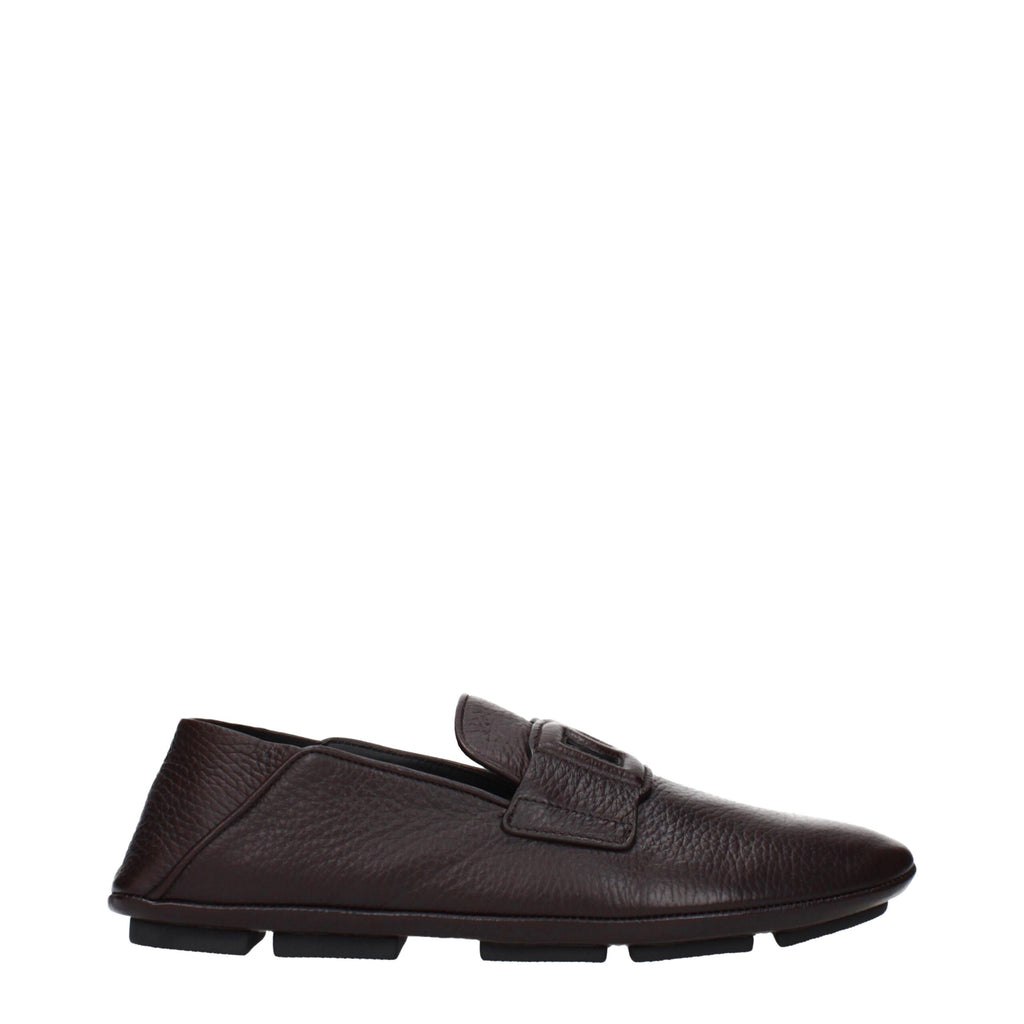 Dolce & Gabbana brown leather slip-on loafers with sleek design and classic stitching on a neutral background.