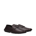 Dolce & Gabbana brown leather slip-on loafers with sleek design and minimal stitching, perfect for stylish casual wear.
